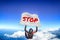 Stop. Flag in skydiving. People in free fall.Teampleat skydiver. Extreme sport.