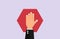 Stop forbidden. Hand holds polygonal red sign warning about danger of traffic prohibition.