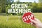 Stop Greenwashing concept with advertising signboard