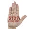 Stop harassment words written on male`s hand. on white background