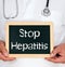 Stop Hepatitis, doctor holding chalkboard with text