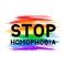 Stop homophobia lettering on LGBT community flag. Symbol of gay pride. Grunge brush strokes texture the colors of the rainbow.
