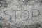 Stop inscription on sand