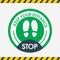 Stop. Keep Your Distance Round. Floor green sticker marking shoe. Vector image. Flat simple design. To protect themselves from