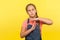 Stop, limit gesture. Portrait of tired unhappy little girl with braid in denim overalls showing timeout, child asking break