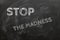 Stop the madness. Sign against false information, bad times, lies - written on a black board