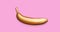 Stop motion animation with golden metallic banana on a pink background. A modern creative concept. Contemporary art