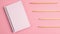 Stop motion animation mockup of white notepad and wooden pencils on pink background. Flat lay top view banner. Education template
