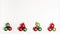 Stop motion animation top view flat lay of four small creative christmas trees of red and green evening balls that change places