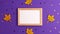 Stop motion animation of yellow felt autumn leaves star shapes and wooden picture frame on purple background with copy space.