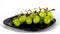 Stop motion of Bunch of green grapes on black plate