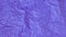 Stop motion of Crumpled purple paper background.