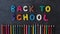 Stop motion hand made plasticine lettering back to school on the blackboard. Fun cartoon rainbow modeling clay. Colored pencils