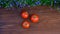 Stop motion. HEALTHY FOOD. Tomatoes emerging on a wooden old table. Group of fresh raw vegetables