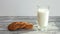 Stop motion of a of homemade oatmeal cookies and a glass of milk. Time-lapse food. 4K movie