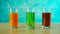 Stop Motion Orange, Apple and Tomato juices filling drinking glasses.