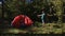 stop motion of a traveler with a tent in the forest