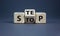 Stop or next step symbol. Turned cubes and changed the word `stop` to `step`. Beautiful grey background, copy space. Business,