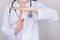 Stop panic concept. Cropped close up photo of nurse making showing timeout symbol isolated over grey background