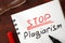 Stop plagiarism sign written.