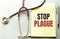 Stop plague written on a clipboard, Medical concept