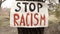 Stop Racism - Banner in the wild - Banner on wood
