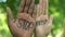 Stop racism words written on palms of african-american and caucasian race people