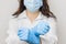 Stop SARS-CoV, SARSCoV, virus 2020 , chinese virus COVID-19. Womans hands in blue medical gloves show STOP sign to