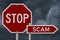 Stop Scam red road sign