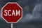 Stop Scam red road sign