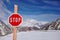 Stop sign. Avalanche sign in front of winter snowy mountains. Danger sign on winter skiing resort