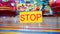 Stop sign with carnival festival blurred Carousel background