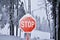 Stop sign covered by snow and frost