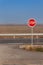 Stop Sign at Crossroads. Rural road. Exit onto the main road. Main road. Dangerous road. Traffic signs stop.