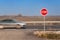 Stop Sign at Crossroads. Rural road. Exit onto the main road. Main road. Dangerous road. Traffic signs stop.