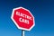 Stop sign with ELECTRIC CARS text to abandon controversial EVs as a future transportation