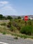 Stop sign erected in the grassy part along the highway in Cody, Wyoming