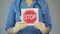 Stop sign in female physician hands, doctor warning about diseases, health care