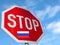 Stop sign with the flag of Russia, symbol against war