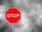 Stop sign in grey sky background. Red Stop Sign, Isolated Traffic Regulatory