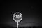 Stop sign, night scene, colorless