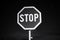 Stop sign, night scene, colorless