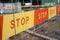 Stop sign ribbon on the construction site