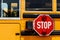 Stop sign on the side of a school bus. It is illegal to pass a bus when this sign is displayed when students are boarding III
