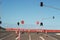 Stop signs and various warning signs warning oncoming traffic of the end of the road on a highway still under construction in