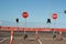 Stop signs and various warning signs warning oncoming traffic of the end of the road on a highway still under construction in