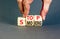 Stop smoking symbol. Concept words Stop smoking on wooden cubes. Beautiful grey table grey background. Doctor hand. Medical,