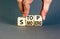 Stop smoking symbol. Concept words Stop smoking on wooden cubes. Beautiful grey table grey background. Doctor hand. Medical,