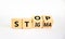 Stop stigma symbol. Turned wooden cubes with words stop stigma. Beautiful white background. Medical and stop stigma concept. Copy