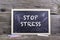 Stop Stress. Old wooden background with texture and chalk blackboard